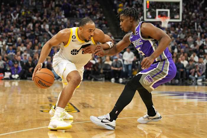 Utah Jazz guard Talen Horton-Tucker (left) dribbles against Sacramento Kings guard Davion Mitchell (15) during the fourth quarter at Golden 1 Center.